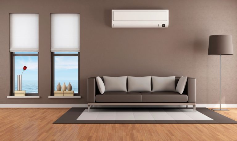 Wall-mounted air conditioning unit installed in a modern living room